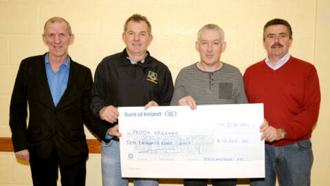 Latest Jackpot Lotto Winner Paddy Vaughan collecting his cheque for €10,000